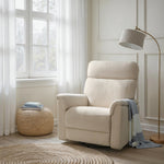 Load image into Gallery viewer, Beige recliner chair in a living room with a lamp and small table.
