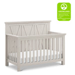 Load image into Gallery viewer, White driftwood Emory crib with Greenguard Gold certification label on a white background
