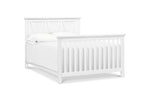 Load image into Gallery viewer, White crib converted to full size bed on a white background
