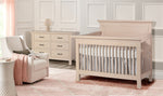 Load image into Gallery viewer, Nursery room with a crib, dresser, and chair in a soft color scheme.
