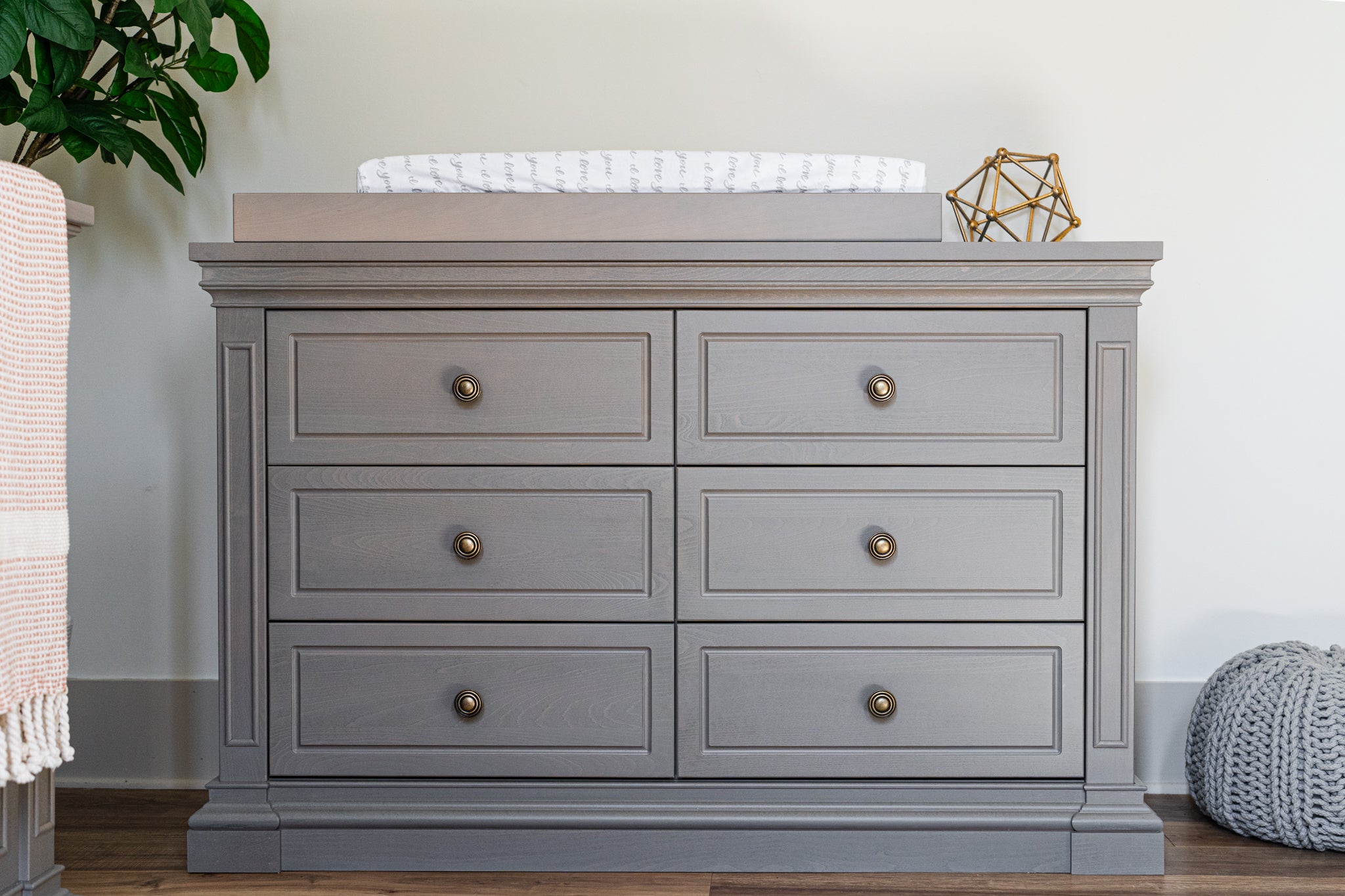 Ash dresser with changing table top in a nursery setting