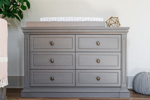 Ash dresser with changing table top in a nursery setting
