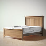 Load image into Gallery viewer, Wooden bed frame with white mattress and gray blanket on a plain background
