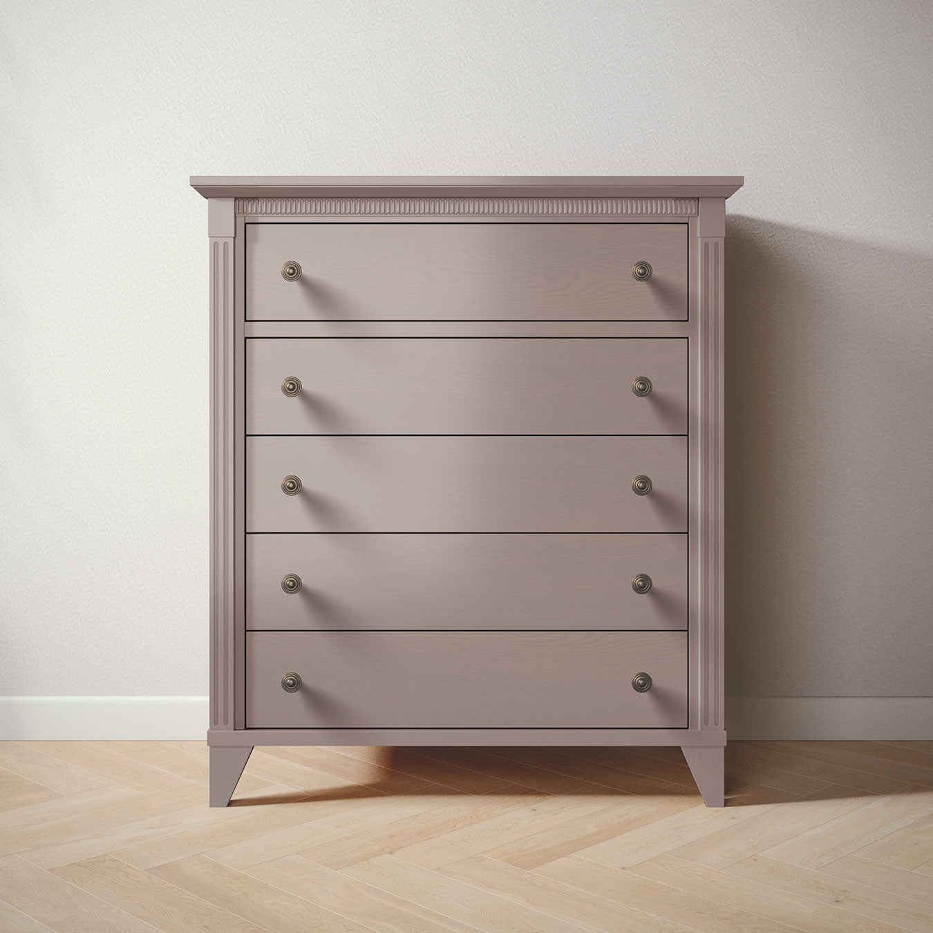 Gray dresser with five drawers on a wooden floor against a white wall