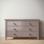 Load image into Gallery viewer, Wooden dresser with six drawers on a wooden floor against a white wall
