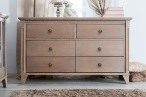 Wooden dresser with multiple drawers in a room setting