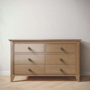 Wooden dresser with  six drawers on a plain background