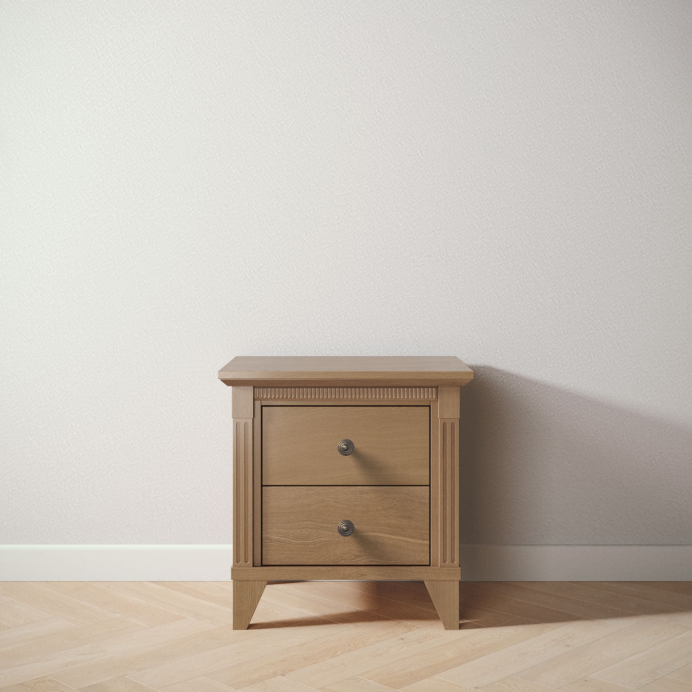 Wooden nightstand with two drawers on a light wooden floor against a white wall