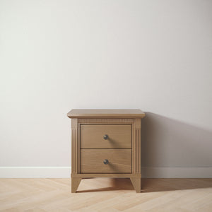 Wooden nightstand with two drawers on a light wooden floor against a white wall