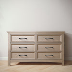 Load image into Gallery viewer, Wooden dresser with six drawers on a wooden floor against a white wall
