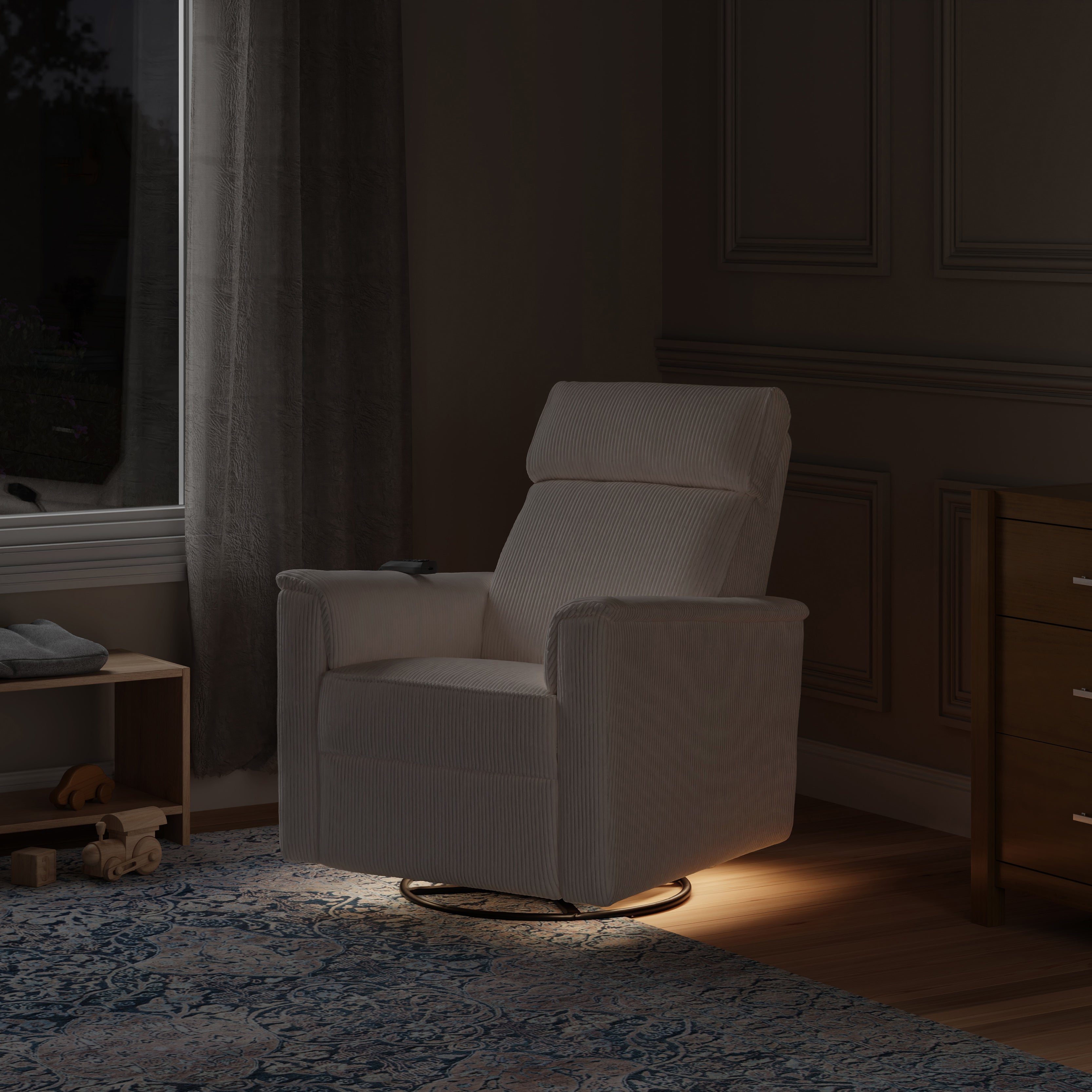 White armchair in a dimly lit room with wooden furniture and a window.