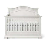 Load image into Gallery viewer, White crib with a decorative headboard on a white background
