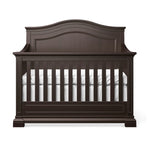 Load image into Gallery viewer, Dark wood crib with white mattress on a white background
