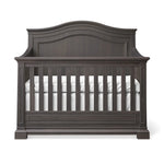 Load image into Gallery viewer, Dark wood crib with white mattress on a white background
