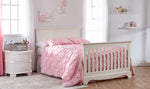 Load image into Gallery viewer, White crib converted to a full bed, with pink bedding in a bright bedroom
