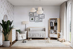 Load image into Gallery viewer, Nursery room with crib, bookshelf, and decorative elements.
