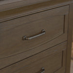 Load image into Gallery viewer, Close-up of a brown wood-grain dresser drawer with a curved silver metal pull handle.
