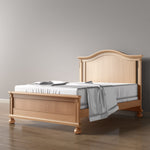 Load image into Gallery viewer, Wooden bed with a gray comforter on a wooden floor against a gray wall
