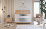 Load image into Gallery viewer, Nursery room with wooden crib, dresser, and wall decor.
