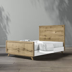 Load image into Gallery viewer, Wooden bed with white mattress against a gray wall
