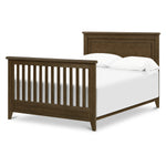 Load image into Gallery viewer, Barrow wooden crib converted to a full size bed, shown with white bedding and pillows.
