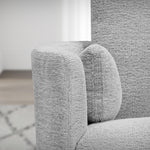 Load image into Gallery viewer, Gray textured armchair in a room with a light-colored rug.
