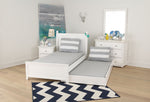 Load image into Gallery viewer, Maxtrix trundle in white, shown underneath a twin bed.
