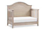 Load image into Gallery viewer, Beckett Rustic curved top crib, converted to daybed, in sandbar 

