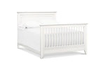 Load image into Gallery viewer, Beckett flat top crib in warm white, shown converted into a full bed.
