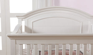 Como curved top crib in vintage white