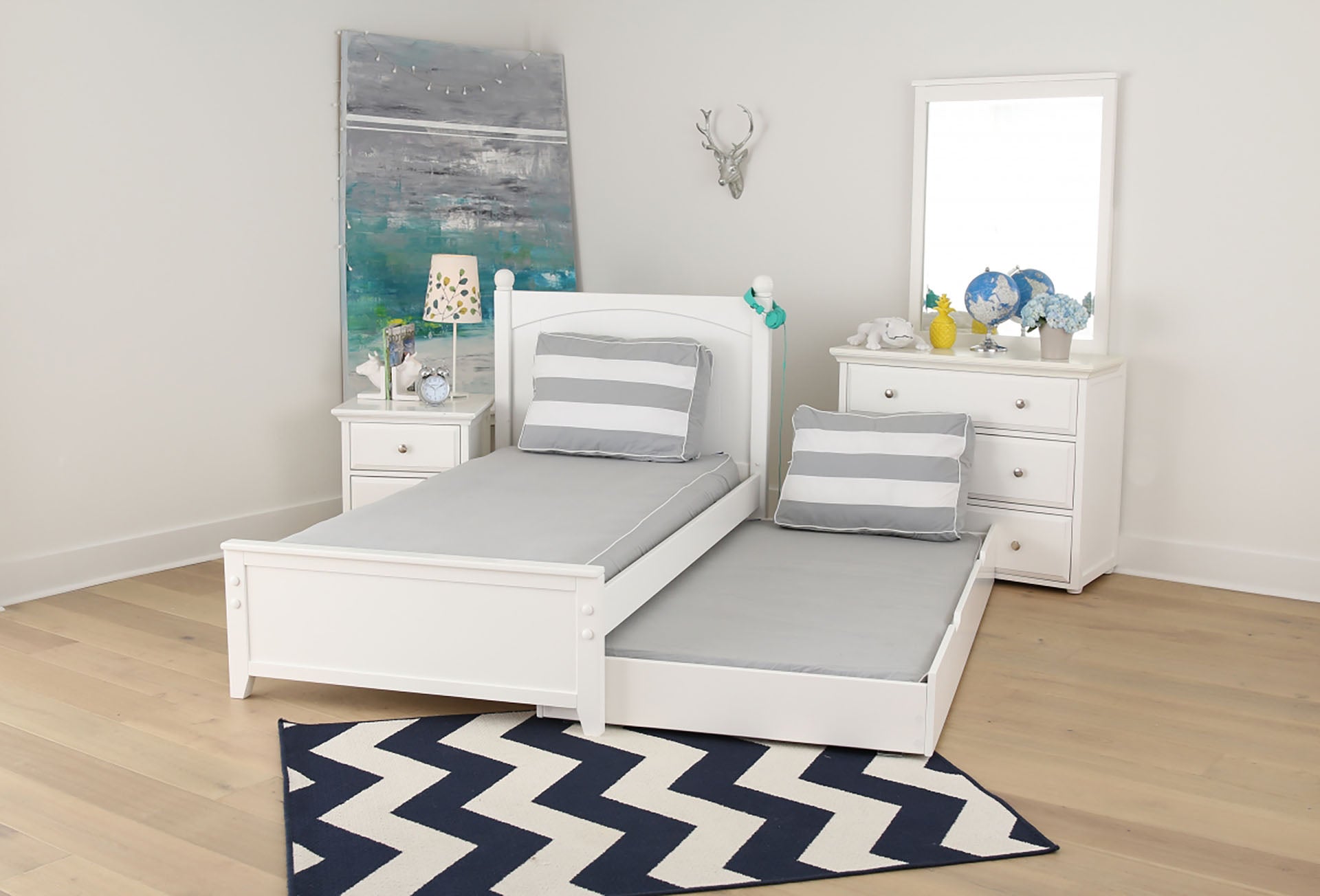 Maxtrix bedroom in white with twin bed & trundle, three drawer dresser & mirror, and nightstand