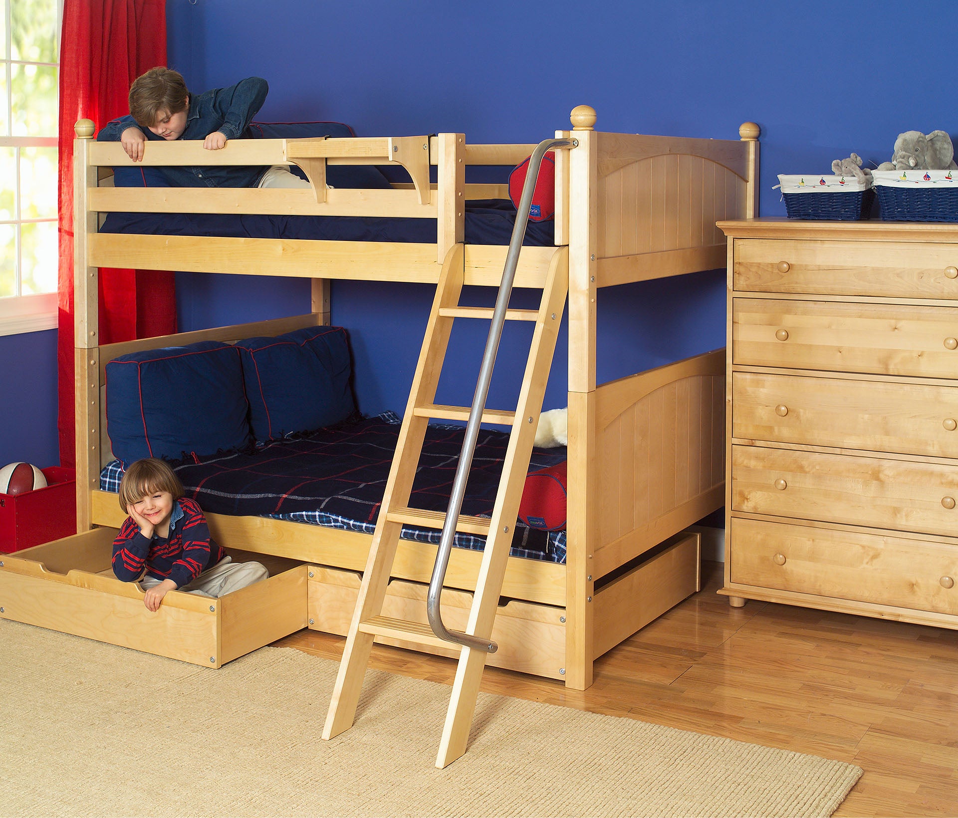 Maxtrix full over full bunk bed with angled ladder in natural, shown with underbed storage drawers & five drawer chest